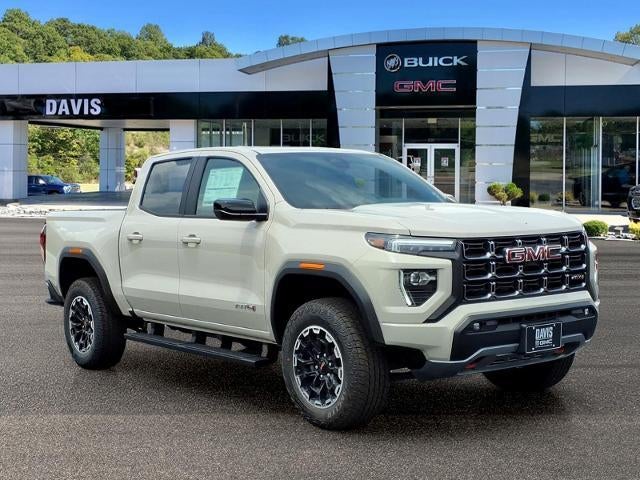 2026 GMC Canyon AT4 in Coastal Dune — front three-quarter view